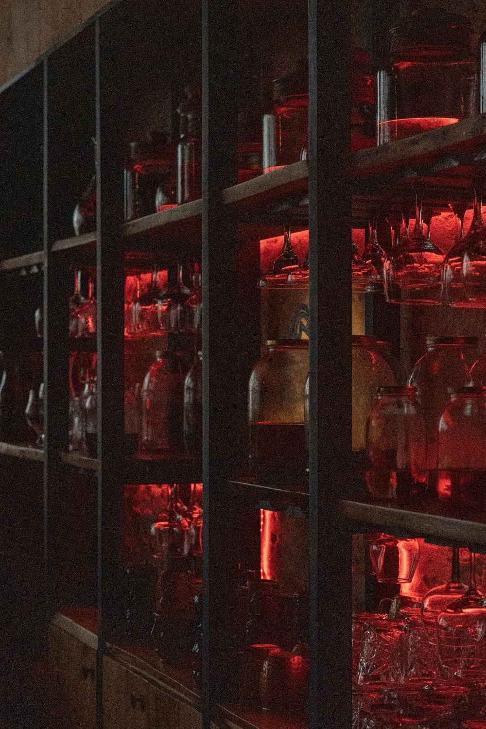 Jars and glasses in red light